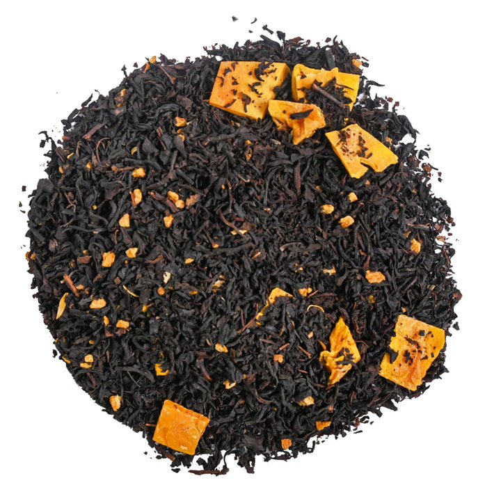 Positively Tea Company Mango Tango organic black tea blend with dried mango and citrus peel pieces, offering a tropical, fruity aroma.