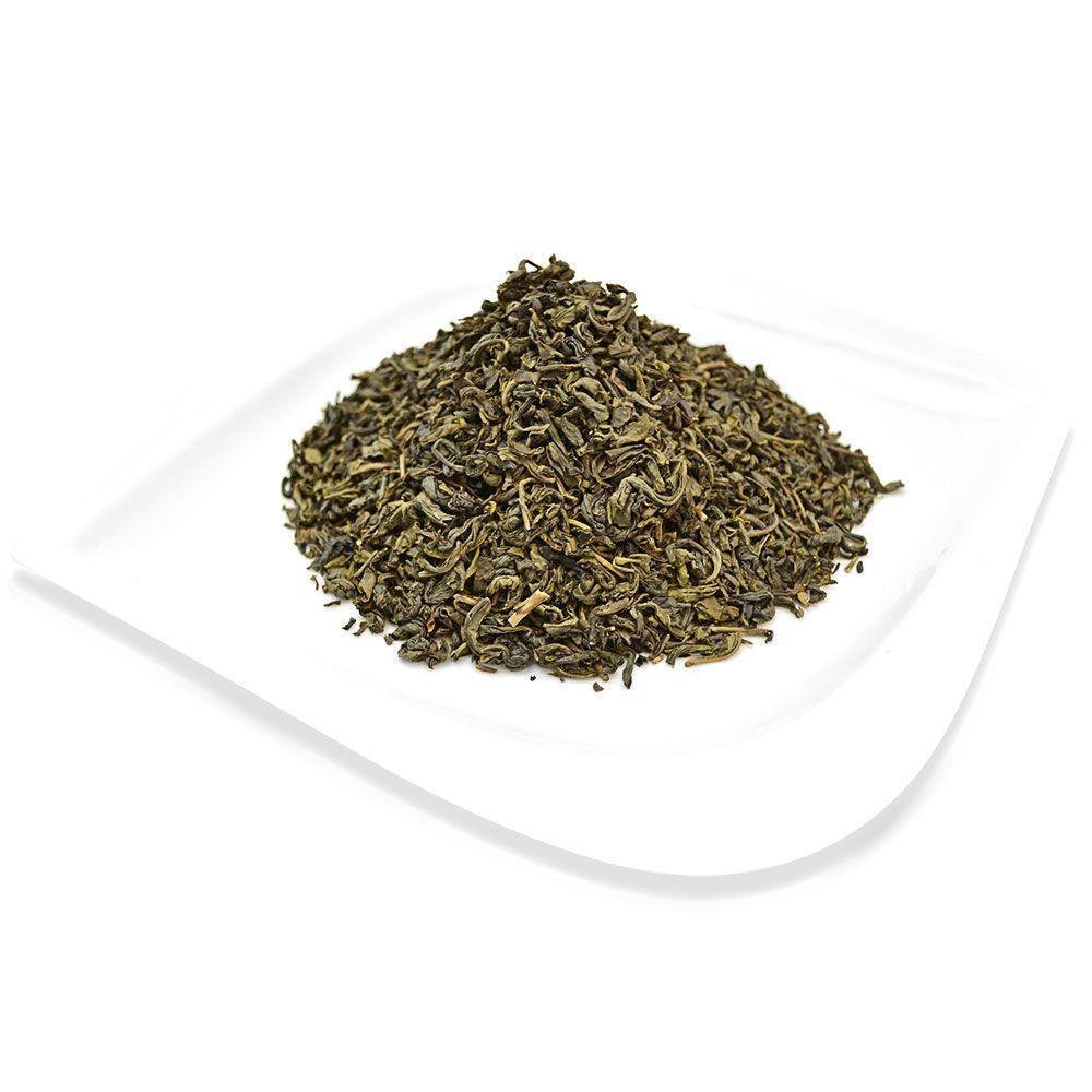 Loose Jasmine Organic Green Tea leaves served on a white plate, featuring a soft floral fragrance and smooth taste.